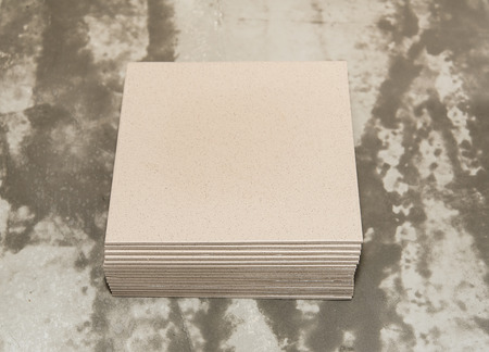 Piles of ceramic tiles on the floor in construction