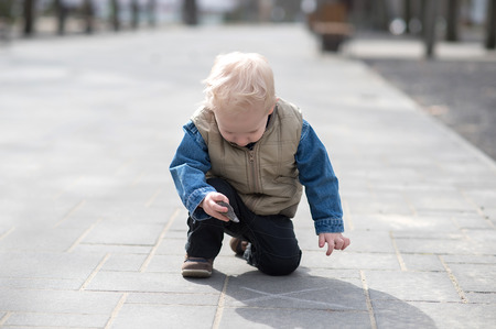Young child play in the sunny parkの写真素材