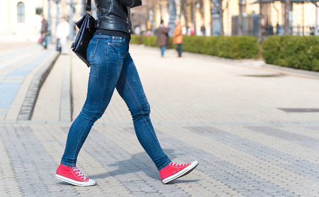 Pretty legs walking on the street. Detailの写真素材
