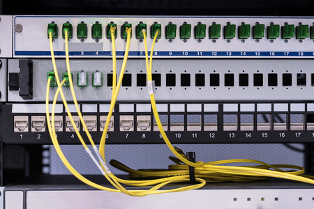 Closeup photo of optical cable in rack cabinet