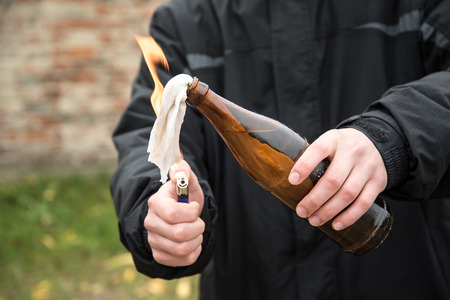Man attack with molotov cocktail in public areaの写真素材