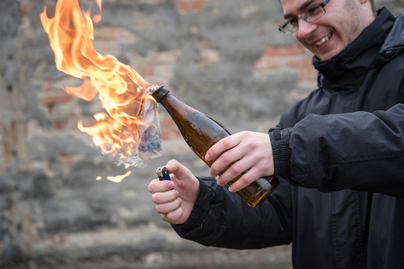 Man attack with molotov cocktail in public areaの写真素材
