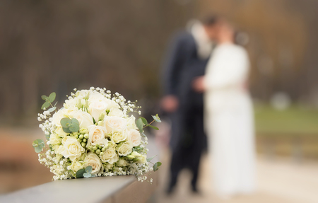 Beautiful wedding bouquet on wooden fenceの写真素材