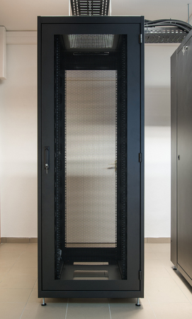 Empty computer server rack cabinet in the room
