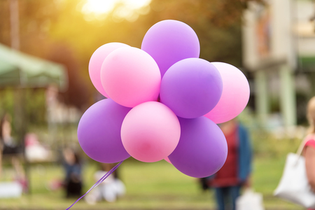 Colorful bunch of air balloons in the streetの写真素材