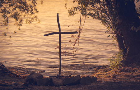 Symbolic cross near the lake in the pet cemetery.の写真素材