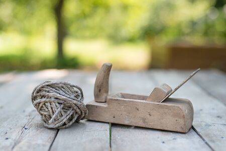 Used wooden planner on a wooden table. Old toolsの写真素材