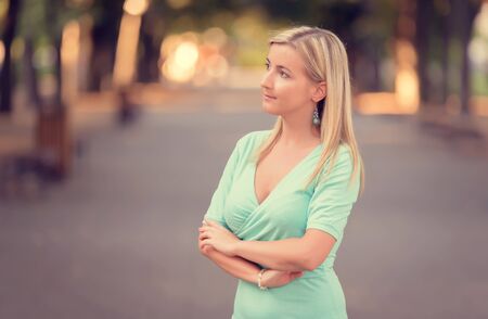 Closeup portrait of a beautiful woman in the streetの写真素材