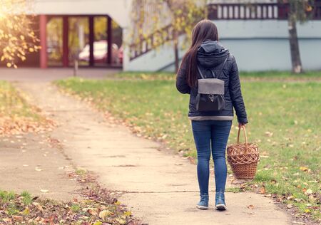 Cute woman going to market with basketの写真素材