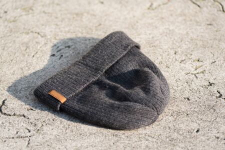Gray textile hat on concreteの写真素材