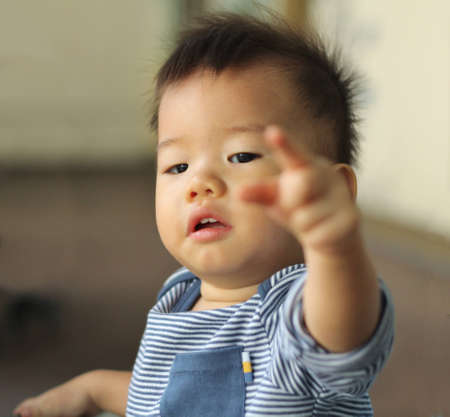 Asian child pointingの写真素材