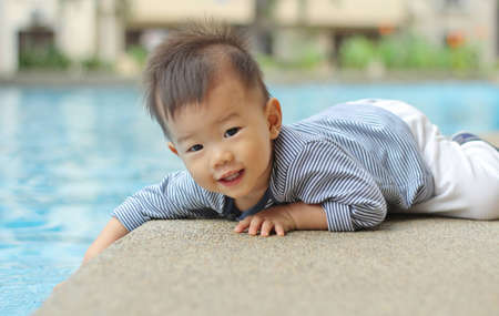 Asian child by the poolの写真素材