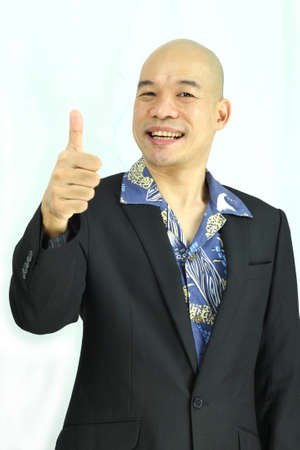 Asian man thumbs upの写真素材