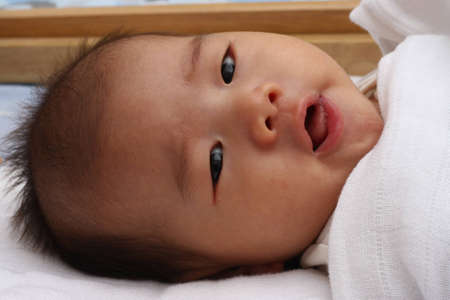 Asian baby woke upの写真素材