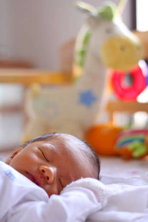 Asian baby sleeping in cotの写真素材