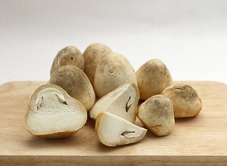 Thai mushrooms on cutting boardの写真素材