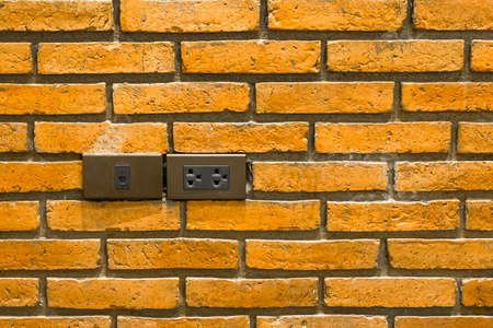 Power socket and lan socket on brick wall.の写真素材