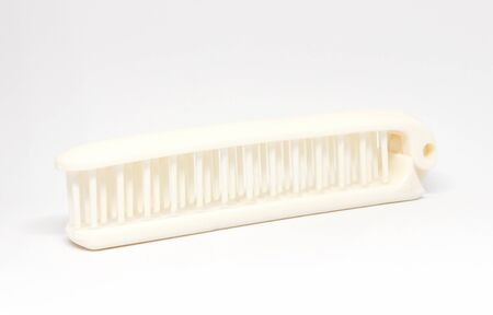 White folding comb.