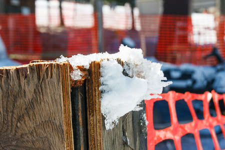 Snow hang on wood pole.