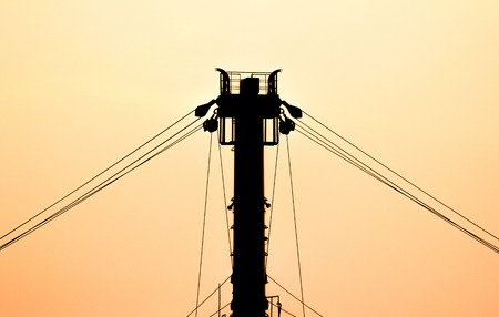 Silhouette pulley on the ship with orange sky.の写真素材