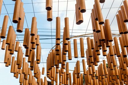 Wooden mobile hanging at Jim Thompson farm, Thailand.の写真素材
