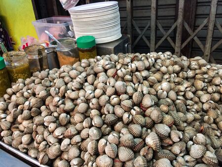 Heap of cockle with spicy sauce.の写真素材