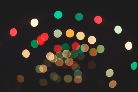 Colorful bokeh in dark background.の写真素材