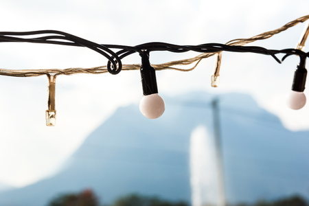 Small light bulb hang with blur background.の写真素材