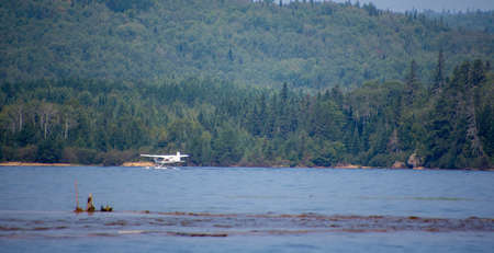 Seaplane taking off on a wild lake in Quebec, Canada