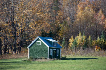 Old barn on a farm in the canadian countryside in Quebec