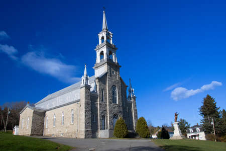 La-Patrie, church in a beautiful blue sky, La Patrie, Quebec, Canada, November 11 2021のeditorial素材