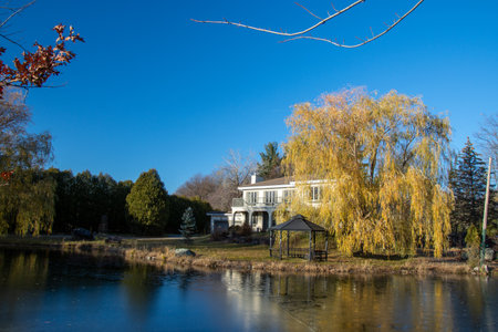 Large house with lake in the Canadian countryside, Mont-St-Hilaire, Quebec, Canada november 24 2021のeditorial素材