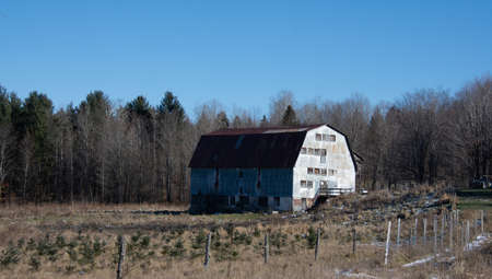 Barn on a farm in the canadian countryside in Quebec, December 05 2021のeditorial素材