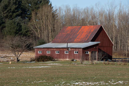 Barn on a farm in the canadian countryside in Quebec, December 05 2021のeditorial素材
