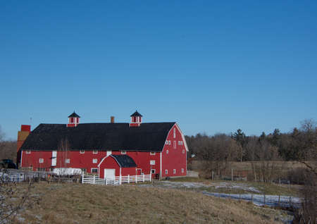 Barn on a farm in the canadian countryside in Quebec, December 05 2021のeditorial素材