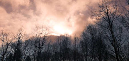 Cloudy December sky with special colors above a public park in Quebec, Canada