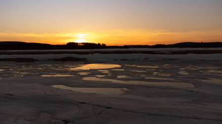Sunset over a lake in a Canadian forest lake in springの写真素材