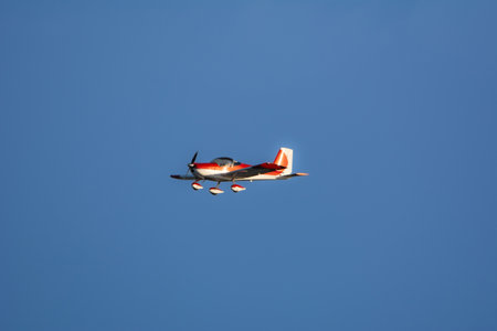 Cute little plane in the sky of Miami at sunset