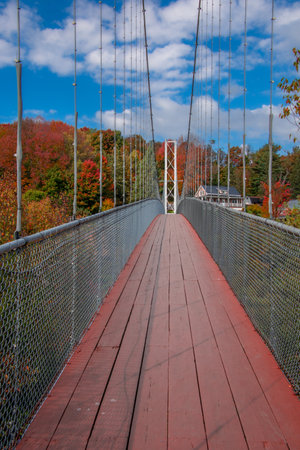 Bridge over a small river in the fall in the Canadian countryside
