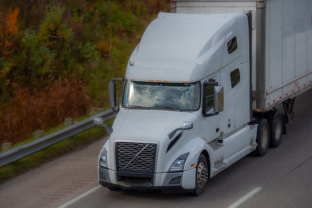 Heavy truck on a highway in the fall