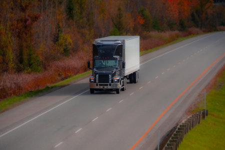 Heavy truck on a Canadian highway in the fall in Quebec