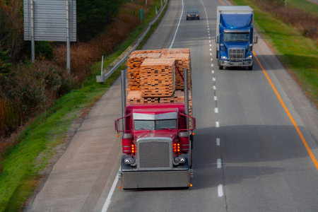 Heavy truck on a Canadian highway in the fall in Quebecの写真素材