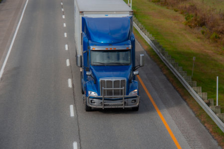 Heavy truck on a Canadian highway in the fall in Quebecの写真素材