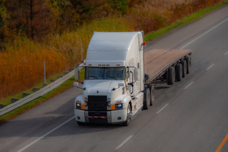 Heavy truck on a Canadian highway in the fall in Quebecの写真素材