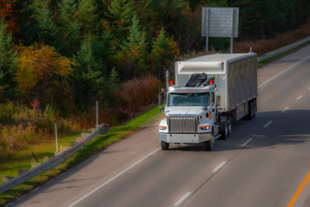 Heavy truck on a Canadian highway in the fall in Quebecの写真素材