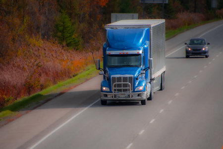 Heavy truck on a Canadian highway in the fall in Quebecの写真素材