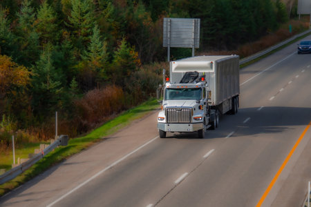 Heavy truck on a Canadian highway in the fall in Quebecの写真素材