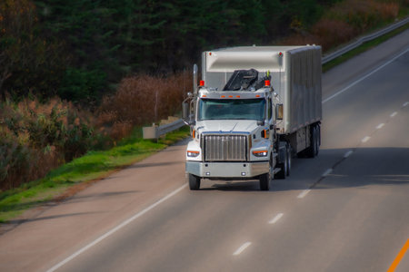 Heavy truck on a Canadian highway in the fall in Quebecの写真素材