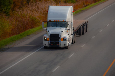 Heavy truck on a Canadian highway in the fall in Quebecの写真素材
