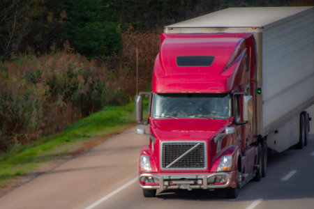 Heavy truck on a Canadian highway in the fall in Quebecの写真素材